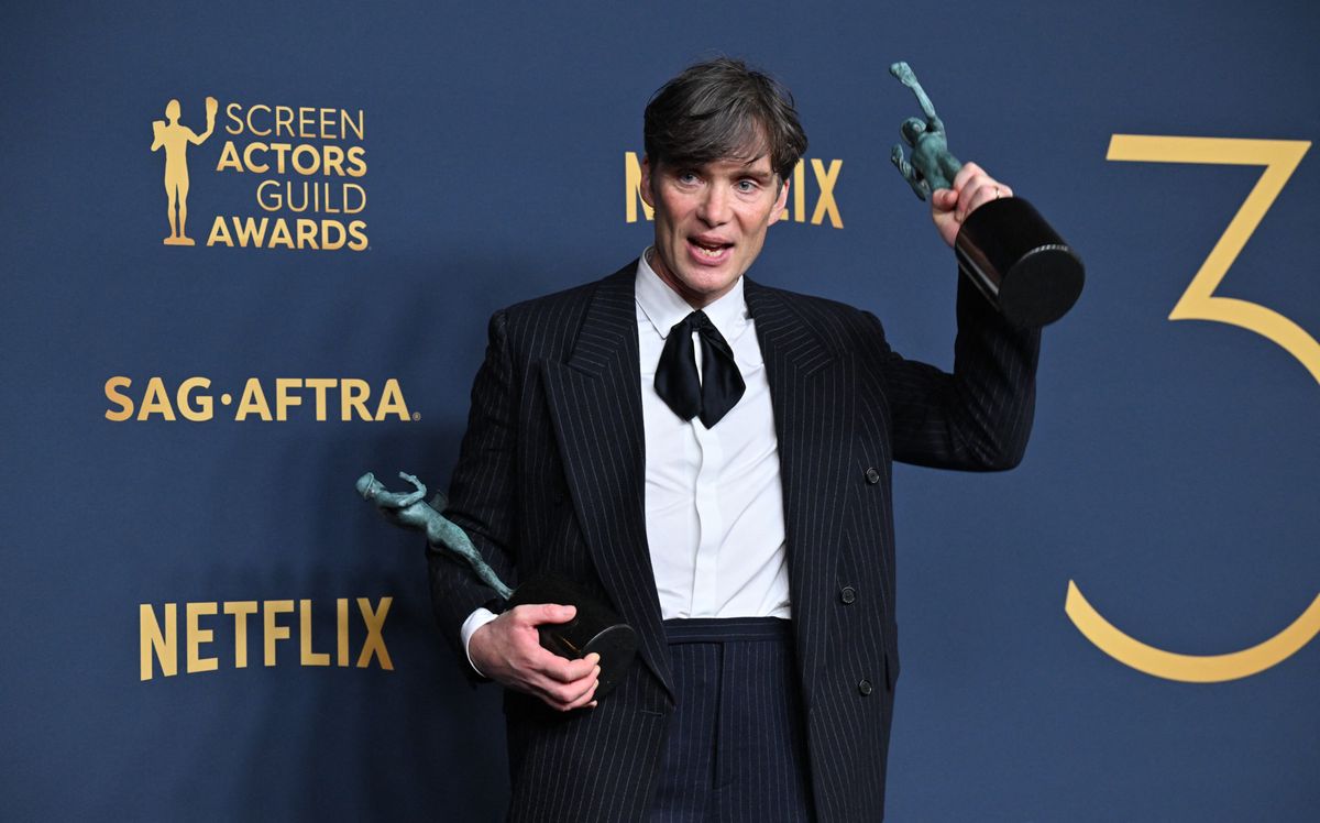 Irish actor Cillian Murphy poses in the press room with the awards for Outstanding Performance by a Male Actor in a Leading Role in a Motion Picture and Outstanding Performance by a Cast in a Motion Picture for "Oppenheimer" during the 30th Annual Screen Actors Guild awards at the Shrine Auditorium in Los Angeles, February 24, 2024. (Photo by Robyn BECK / AFP)