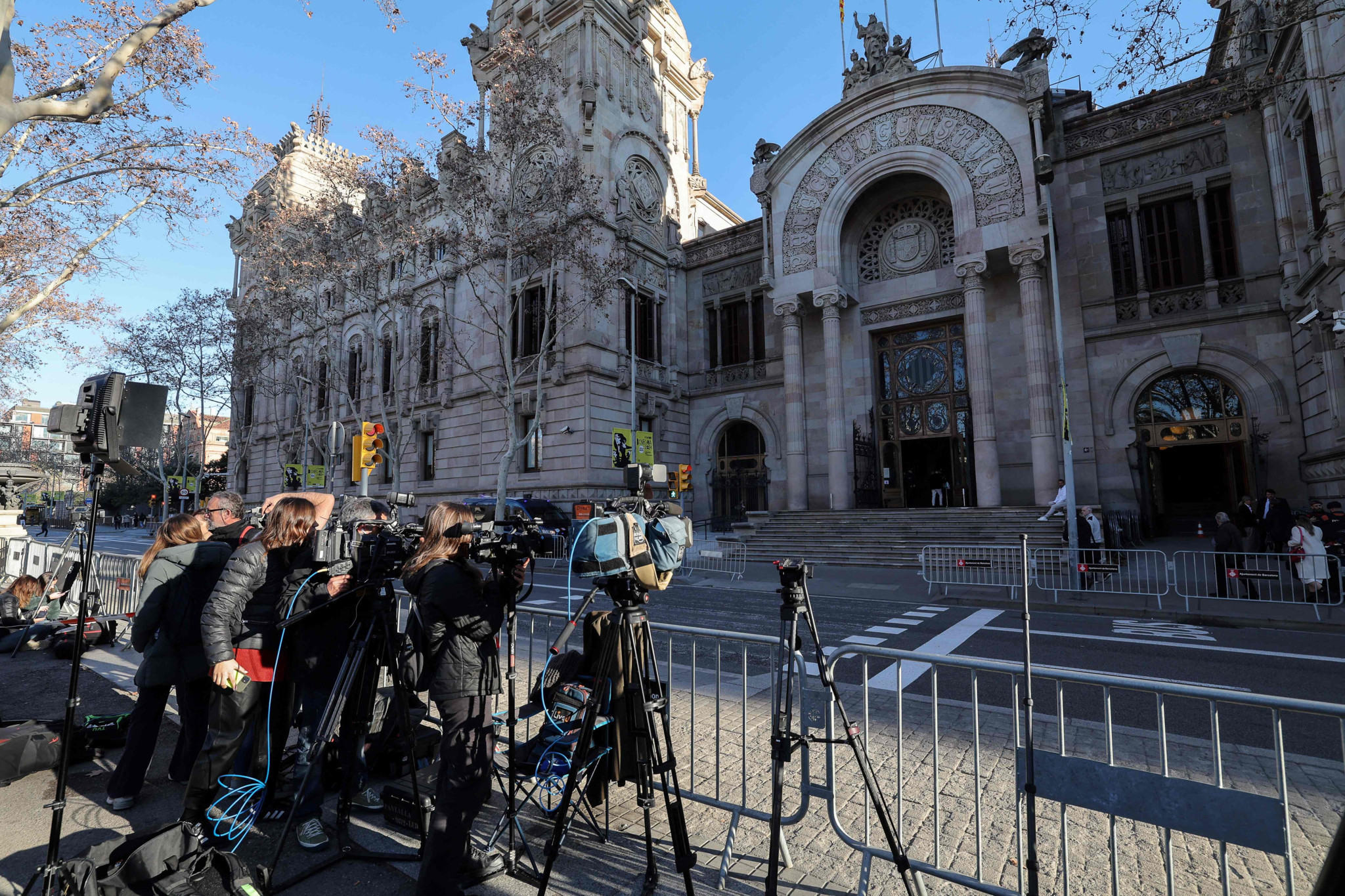 Journalists gather in front of the High Court of Justice of Catalonia, ahead of the start of Brazilian footballer Dani Alves' trial in Barcelona, on February 5, 2024. Brazilian footballer Dani Alves, a former star at Barca and PSG, goes on trial in Barcelona accused of raping a woman in a local nightclub. Prosecutors are asking for a nine-year prison sentence, followed by 10 years of conditional liberty. They are also asking he pay 150,000 euros ($162,000) in compensation to the woman. (Photo by LLUIS GENE / AFP)