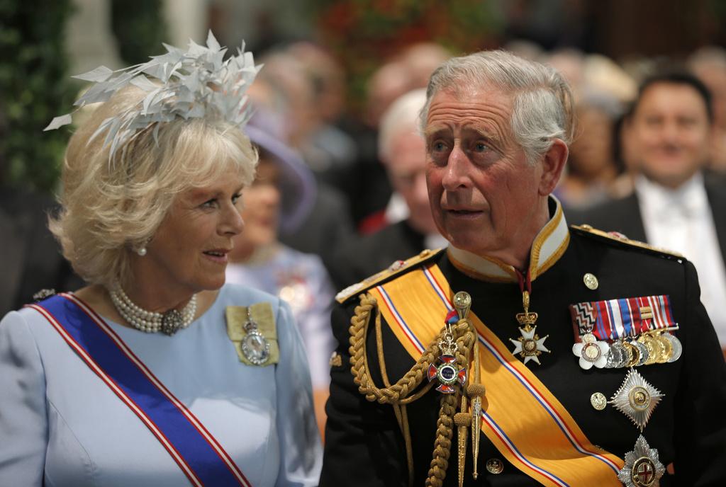 Britain's Prince Charles and his wife Camila, Duchess of Cornwall take their seats at the Nieuwe Kerk or New Church in Amsterdam, The Netherlands, for the inauguration of King Willem-Alexander Tuesday April 30, 2013. Around a million people are expected to descend on the Dutch capital for a huge street party to celebrate the first new Dutch monarch in 33 years. (AP Photo/Peter Dejong, Pool)