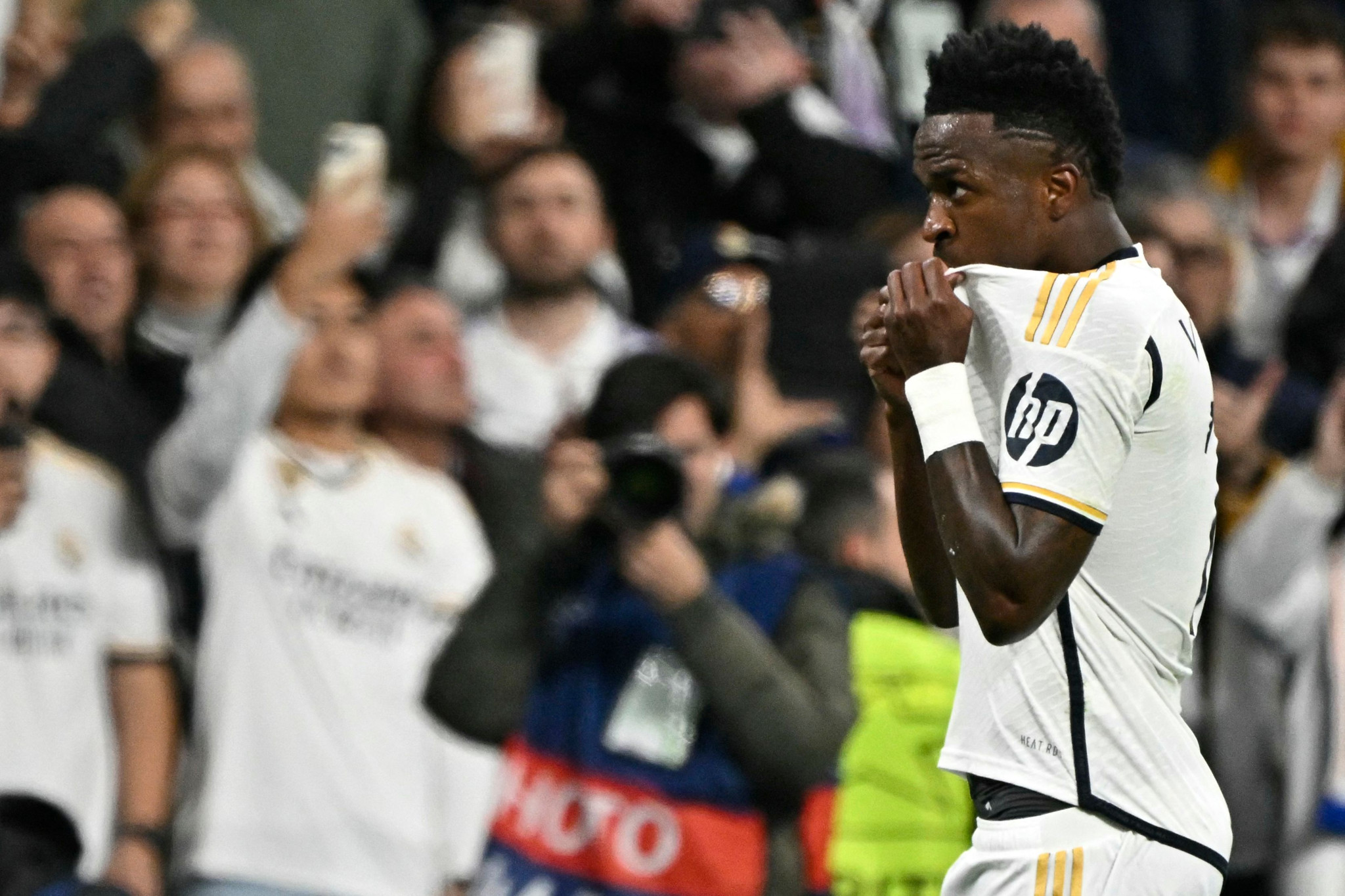Real Madrid's Brazilian forward #07 Vinicius Junior celebrates scoring the opening goal, during the UEFA Champions League last 16 second leg football match between Real Madrid CF and RB Leipzig at the Santiago Bernabeu stadium in Madrid on March 6, 2024. (Photo by JAVIER SORIANO / AFP)