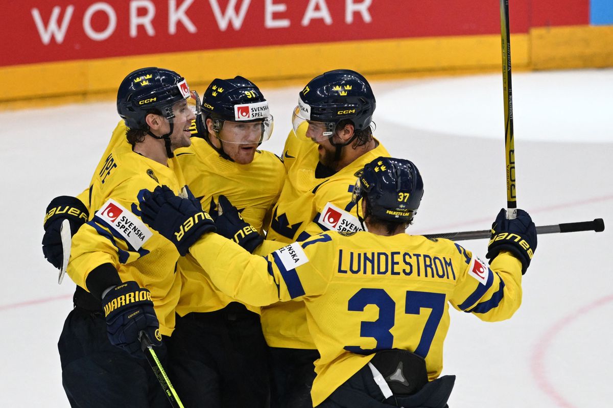Sweden’s players celebrate after scoring during the IIHF Ice Hockey Men's World Championship -  bronze medal match between Canada and Sweden in Prague, Czech Republic on May 27, 2024. (Photo by Michal Cizek / AFP)