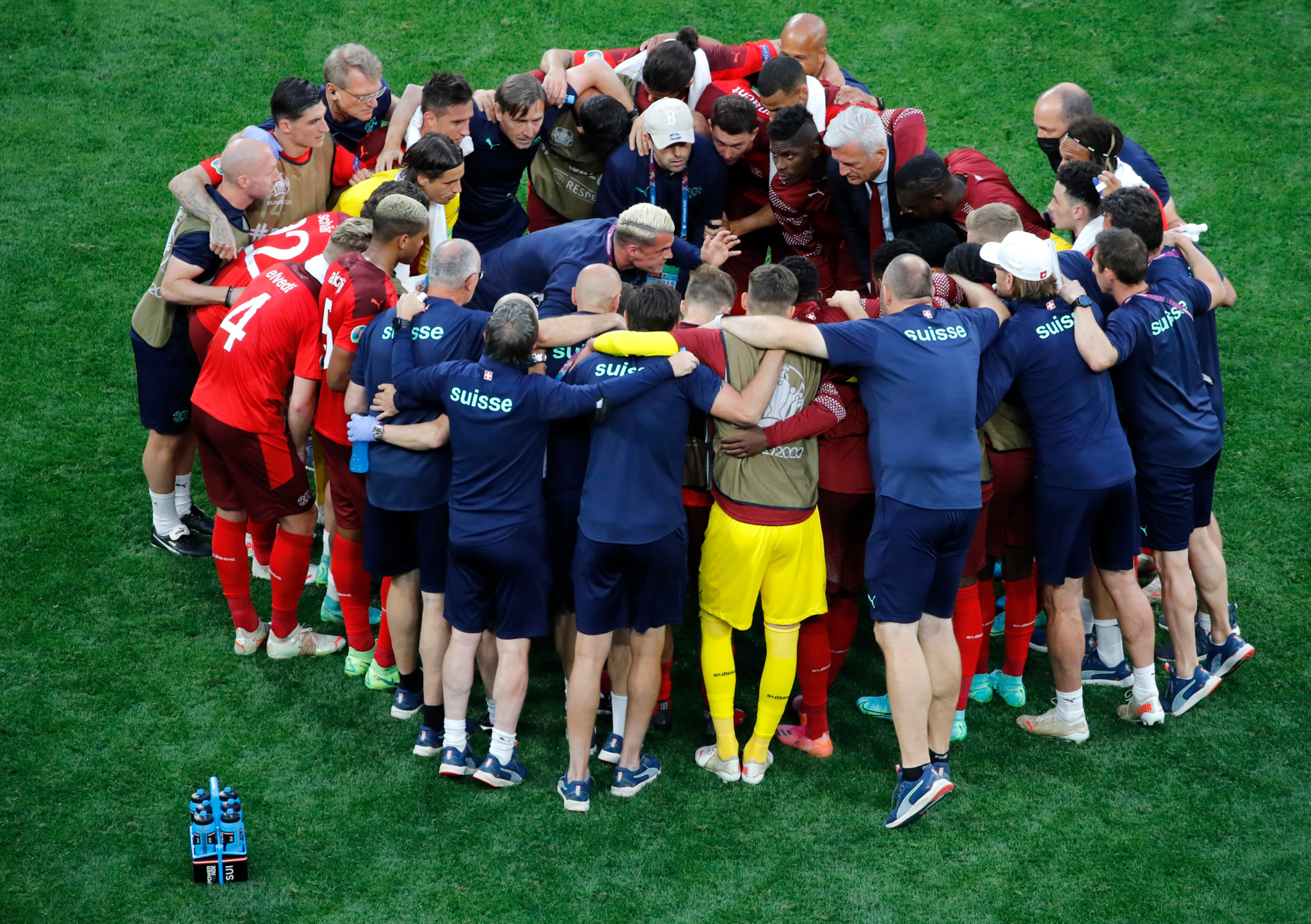 Switzerland's Granit Xhaka, center, talks to his teammates during the Euro 2020 soccer championship quarterfinal match between Switzerland and Spain at Saint Petersburg Stadium in St. Petersburg, Russia, Friday, July 2, 2021. (Anton Vaganov/Pool via AP)