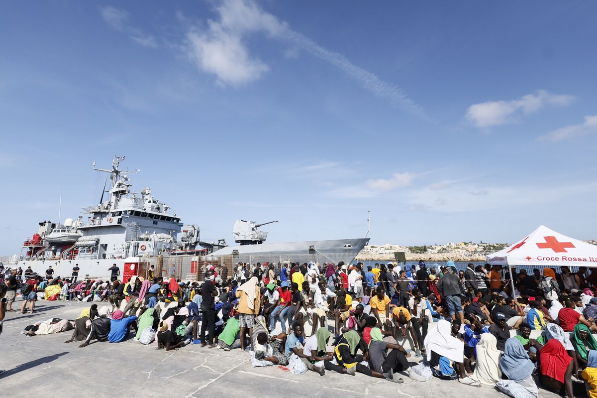 Migrants wait to be transferred from the Lampedusa Island to the mainland, Friday, Sept. 15, 2023. Lampedusa, which is closer to Africa than the Italian mainland, has been overwhelmed this week by thousands of people hoping to reach Europe from Tunisia, which has replaced Libya as the main base of operations for migrant smuggling operations in the Mediterranean. (Cecilia Fabiano/LaPresse via AP)