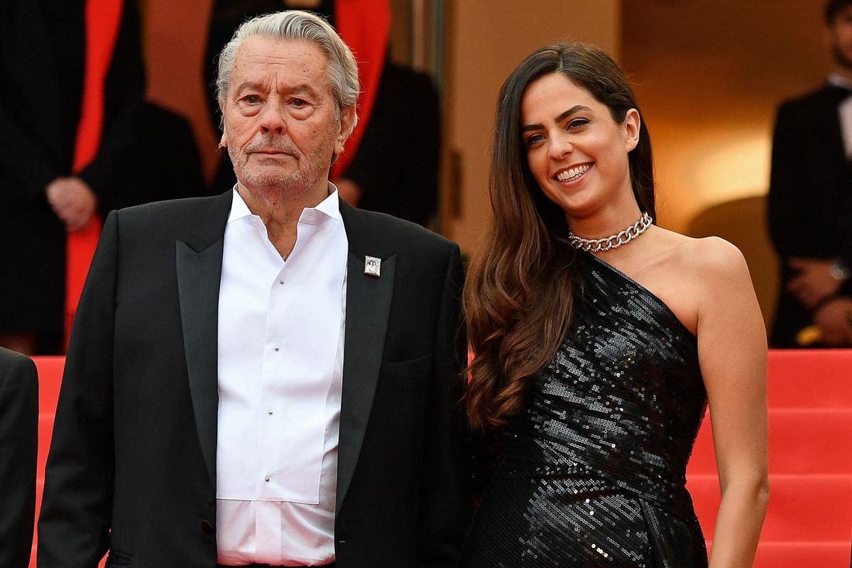 (FILES) French actor Alain Delon (L) poses with his daughter Anouchka Delon (R) as he arrives to be awarded with an Honorary Palme d'Or at the 72nd edition of the Cannes Film Festival in Cannes, southern France, on May 19, 2019. Actor Alain Delon, "extremely shocked by the media debacle orchestrated by his son Anthony", is to lodge a complaint against him, denouncing comments aimed at "harming" him and his daughter Anouchka, his lawyer Christophe Ayela announced in a statement sent to AFP on January 4, 2024. (Photo by Alberto PIZZOLI / AFP)