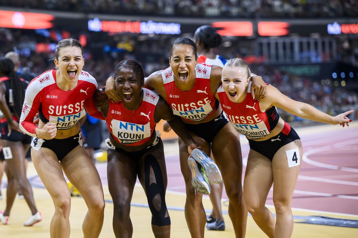Geraldine Frey, Natacha Kouni, Salome Kora and Melissa Gutschmidt of Switzerland react during the women's 4x100 meters relay qualification of the World Athletics Championships at the National Athletics Centre, in Budapest, Hungary, Friday, August 25, 2023. (KEYSTONE/Jean-Christophe Bott)