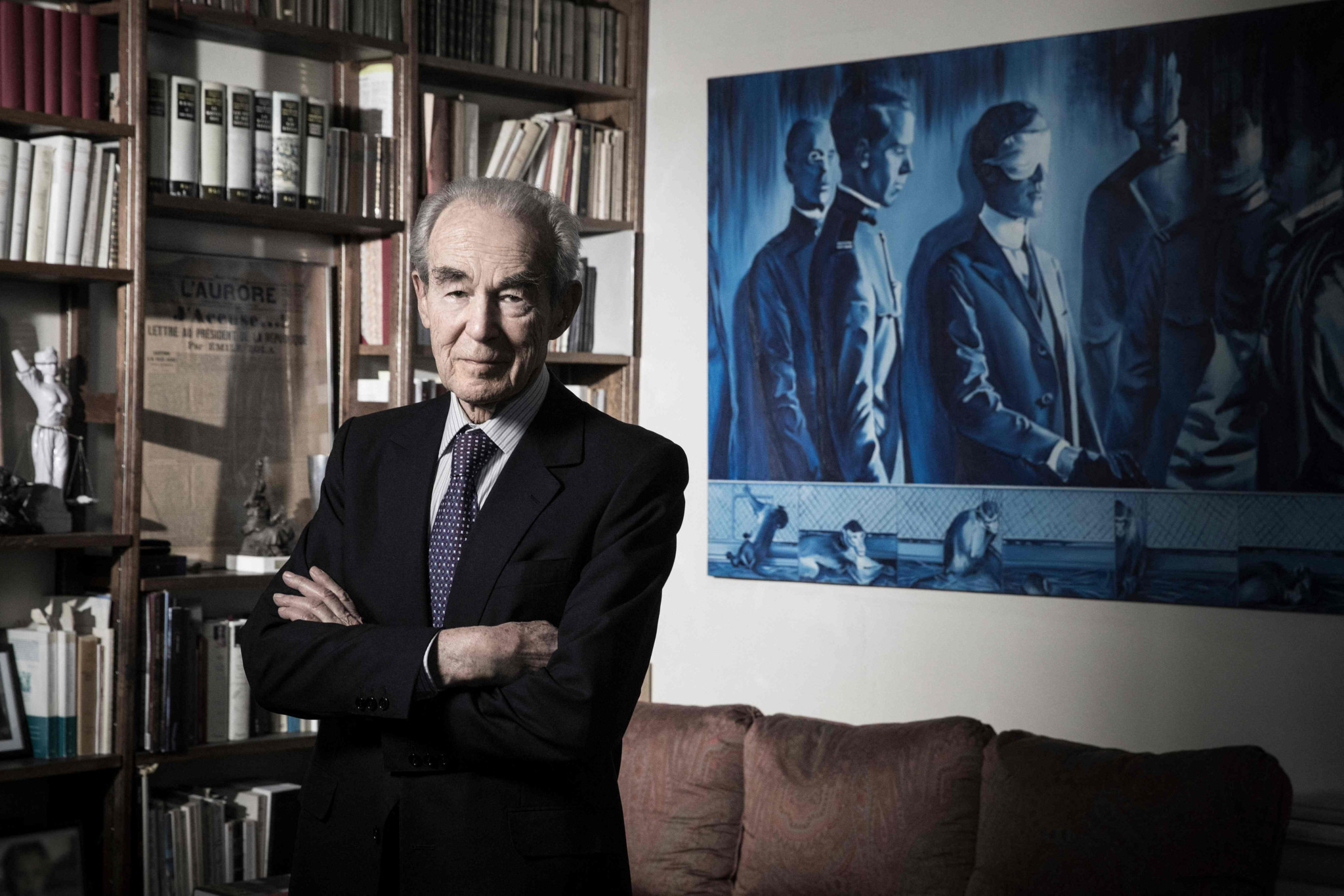 (FILES) Former French Justice Minister Robert Badinter poses in his office during a photo session in Paris on April 19, 2018. An aide reported on February 9, 2024 that Robert Badinter has died at the age of 95. (Photo by JOEL SAGET / AFP)