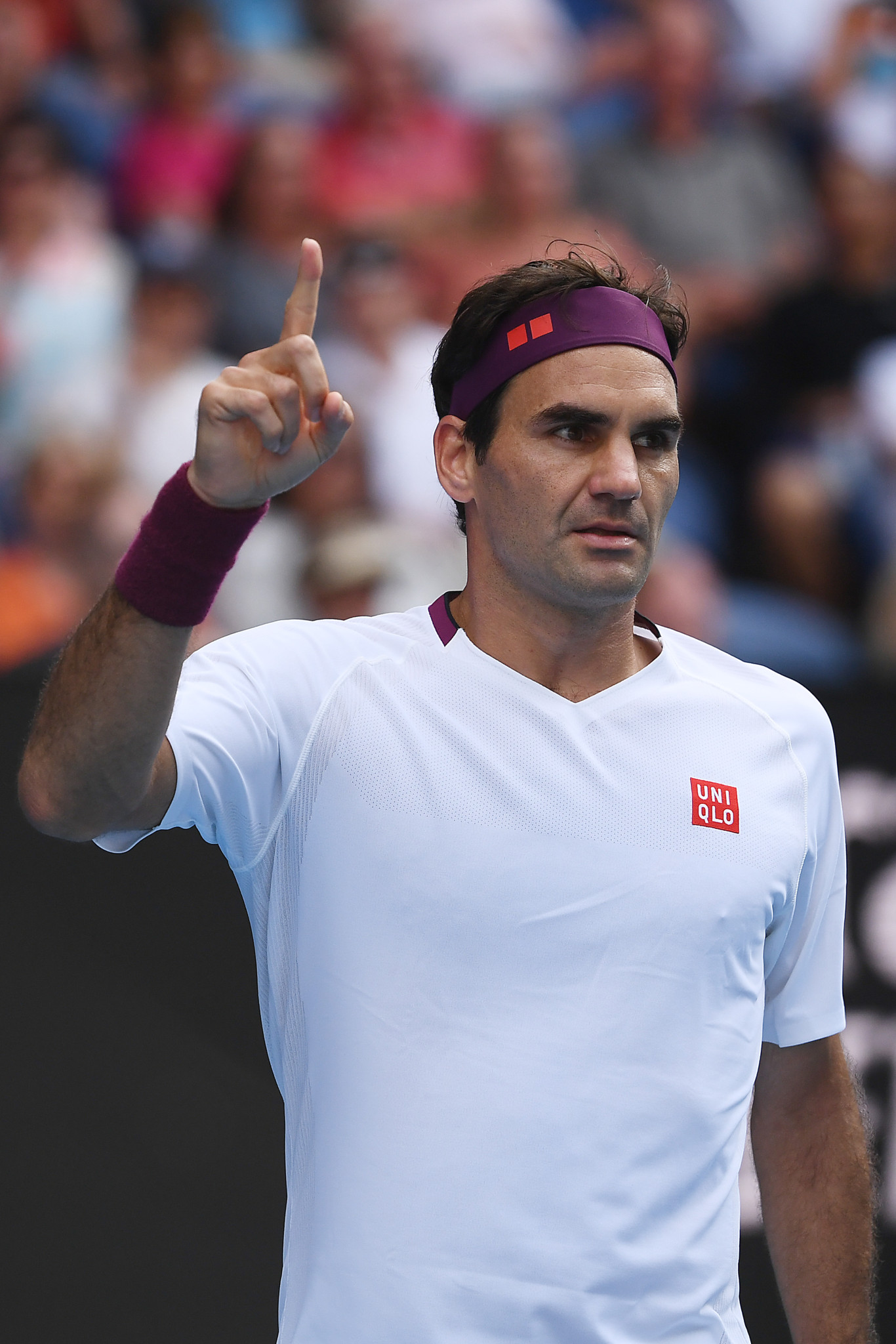 Roger Federer celebrates after winning the fourth set in the quarterfinals of the Australian Open 2020 against Tennys Sandgren.