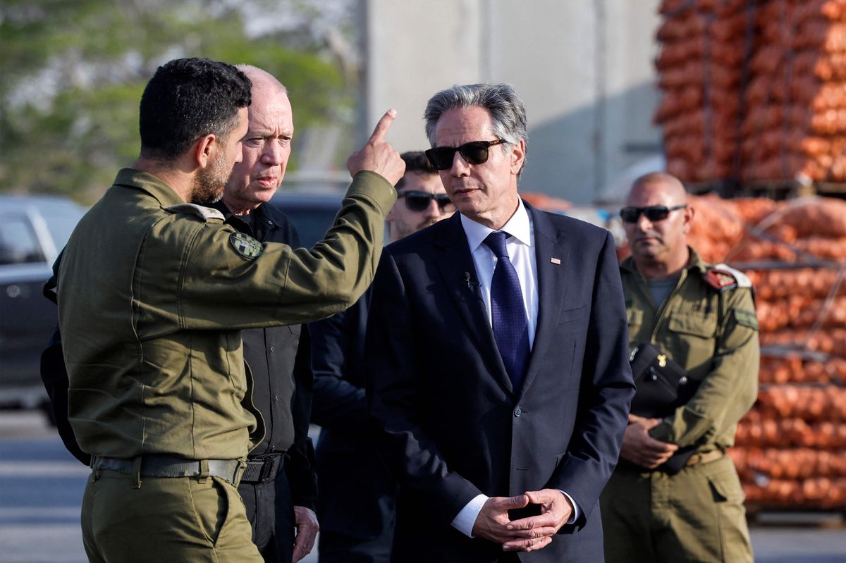 US Secretary of State Antony Blinken (C) stands with Israeli Defence Minister Yoav Gallant (C-L behind) at the Kerem Shalom border crossing with the Gaza Strip in southern Israel on May 1, 2024. (Photo by Evelyn Hockstein / POOL / AFP)