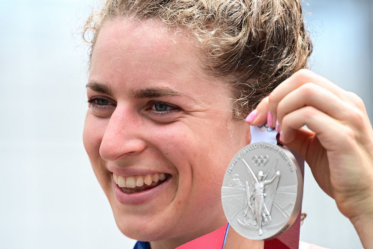Silver medalist Switzerland's Marlen Reusser celebrates on the podium of the women's cycling road individual time trial during the Tokyo 2020 Olympic Games at the Fuji International Speedway in Oyama, Japan, on July 28, 2021. (Photo by Ina FASSBENDER / AFP)