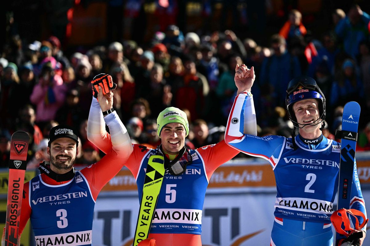 Second placed Switzerland's Loic Meillard (L), First placed Switzerland's Daniel Yule and Third placed France's Clement Noel pose after competing in the second run of the Men's Slalom event during the FIS Alpine ski World Cup in Chamonix, on February 4, 2024. (Photo by Jeff PACHOUD / AFP)