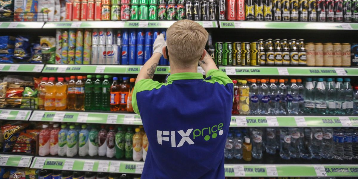 A worker replenishes stock inside a Fix Price discount store in Moscow, Russia, on Friday, Oct. 30, 2020. Russias biggest dollar-store retailer plans to build on the previously unreported sale of a minority stake to the Goldman Sachs fund, according to Fix Price founder Sergei Lomakin. Photographer: Andrey Rudakov/Bloomberg via Getty Images