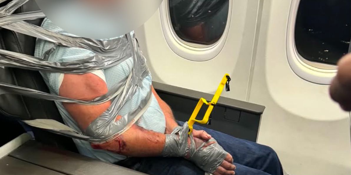 American Airlines: Rioter bound with tape