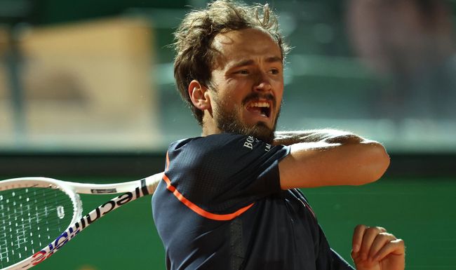 MONTE-CARLO, MONACO - APRIL 13: Daniil Medvedev plays a forehand against Alexander Zverev of Germany in their third round match during day five of the Rolex Monte-Carlo Masters at Monte-Carlo Country Club on April 13, 2023 in Monte-Carlo, Monaco. (Photo by Clive Brunskill/Getty Images)