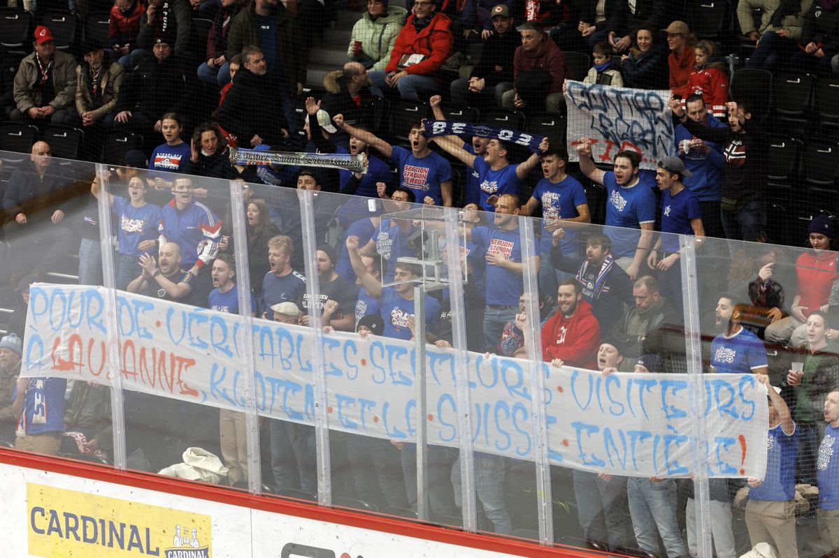 Kloten's supporters display a banner for protesting against the conditions in visitor section, during a National League regular season game of the Swiss Championship between Lausanne HC and EHC Kloten, at the Vaudoise Arena in Lausanne, Switzerland, Sunday, January 7, 2024. (KEYSTONE/Salvatore Di Nolfi)