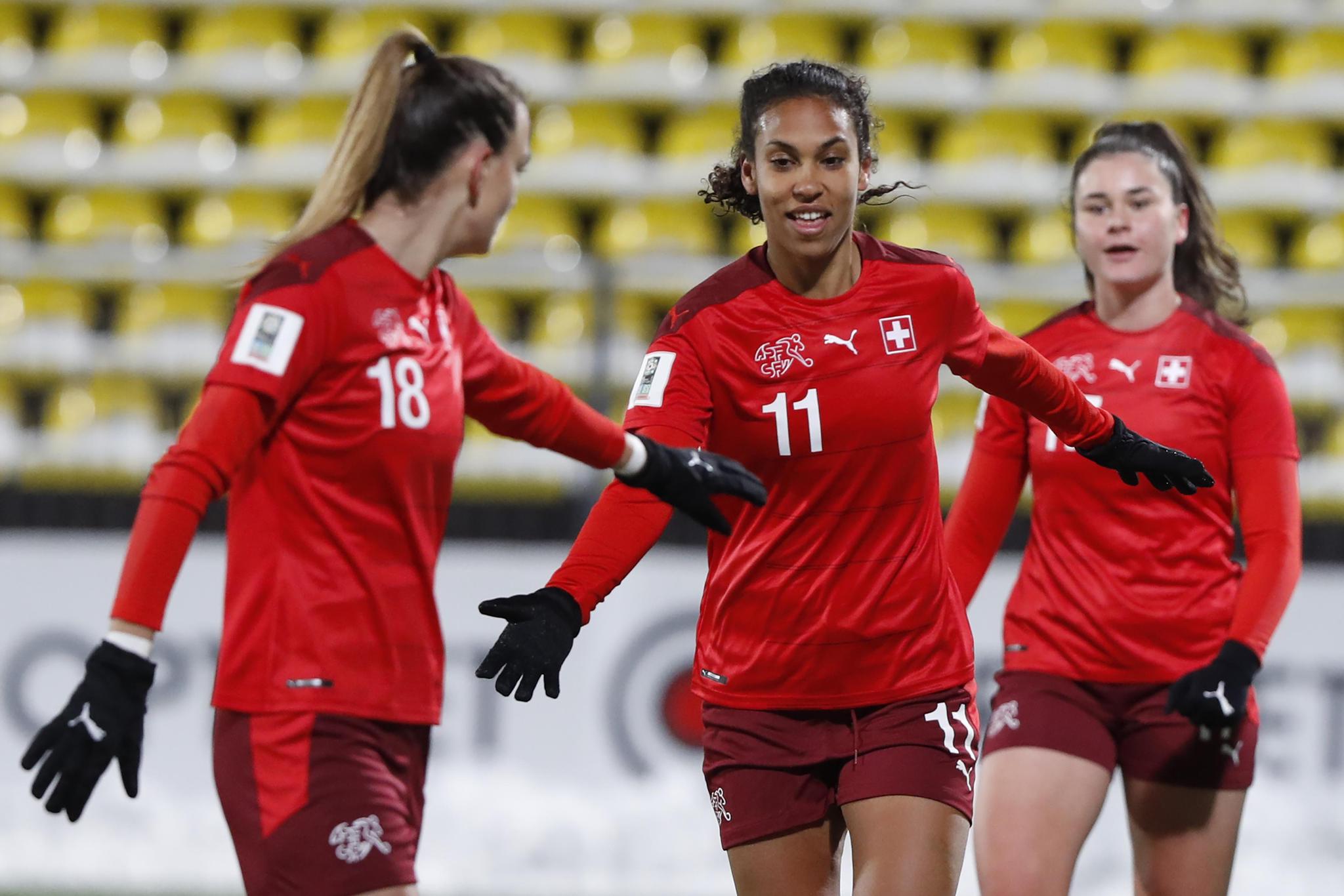 Switzerland's Coumba Sow, center, celebrates with teammates after scoring her side's third goal during the Women's World Cup 2023 Group G qualifying soccer match between Lithuania and Switzerland at LFF stadium in Vilnius, Tuesday, Nov. 30, 2021. (AP Photo/Mindaugas Kulbis)
