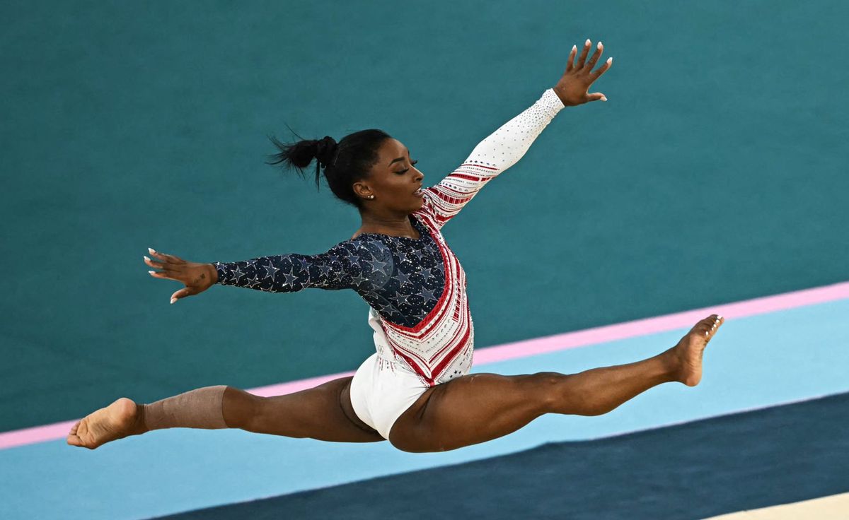 US' Simone Biles competes in the floor exercise event of the artistic gymnastics women's team final during the Paris 2024 Olympic Games at the Bercy Arena in Paris, on July 30, 2024. (Photo by Paul ELLIS / AFP)