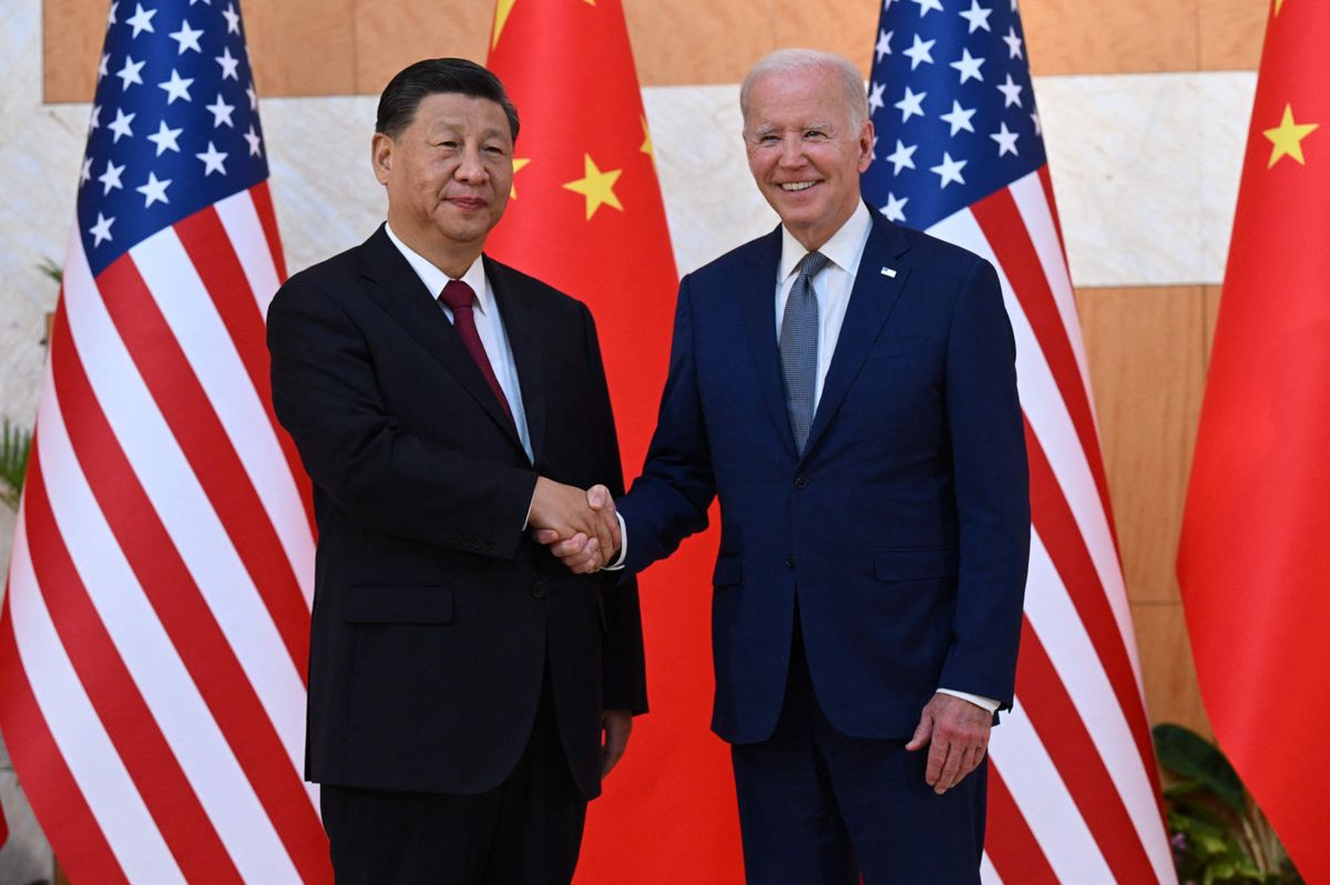 (FILES) US President Joe Biden (R) and China's President Xi Jinping (L) shakes hands as they meet on the sidelines of the G20 Summit in Nusa Dua on the Indonesian resort island of Bali on November 14, 2022. Chinese President Xi Jinping arrived in San Francisco on November 14, 2023, a day ahead of his highly anticipated meeting with American counterpart Joe Biden. Xi last traveled to the United States six years ago, and is due for lengthy talks with Biden in their first in-person meeting in a year. The two presidents are meeting on the sidelines of the Asia-Pacific Economic Cooperation (APEC) summit as both countries seek to stabilize ties. (Photo by SAUL LOEB / AFP)