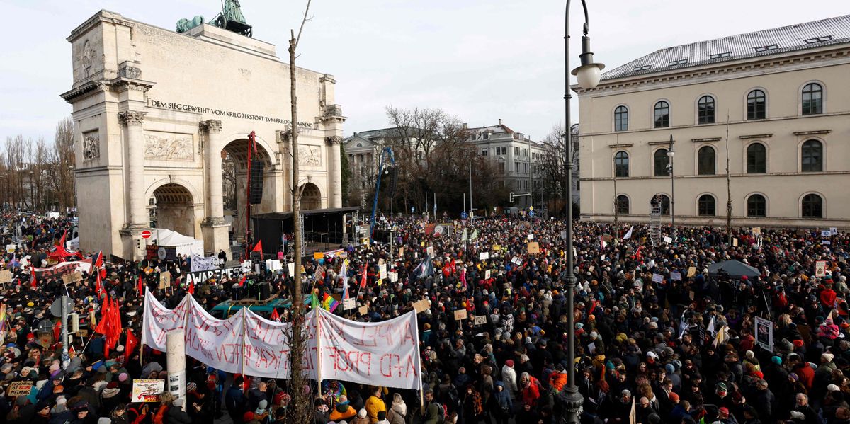 Participants gather for a demonstration against racism and far-right politics in front of the Siegestor (Victory Gate) memorial arch in Munich, southern Germany on January 21, 2024. A protest march against the far right in Munich was broken off on January 21 after tens of thousands of people descended on the German city centre. Organisers said some 50,000 people had turned up to the demonstration, twice as many as were registered for the event, while other estimates put the figure even higher, according to AFP journalist. (Photo by MICHAELA STACHE / AFP)