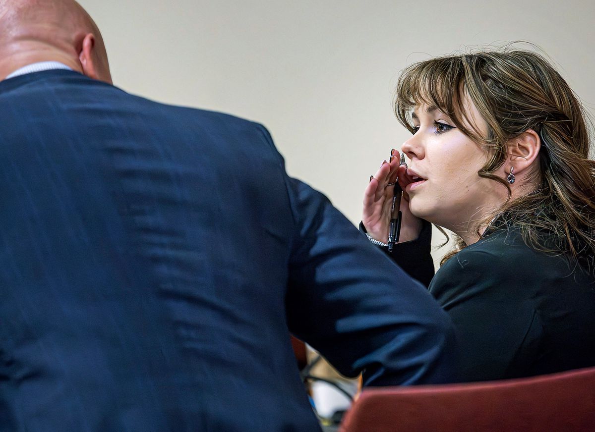 SANTA FE, NEW MEXICO - MARCH 01: Hannah Gutierrez-Reed (R) talks with her attorney Jason Bowles (L) during the trial against her in First District Court on March 1, 2024 in Santa Fe, New Mexico. Gutierrez-Reed, who was working as the armorer on the movie "Rust" when cinematographer Halyna Hutchins was killed by a misfire, is charged with involuntary manslaughter and tampering with evidence. Gutierrez-Reed, who was working as the armorer on the movie "Rust" when a revolver actor Alec Baldwin was holding fired killing cinematographer Halyna Hutchins and wounded the film's director Joel Souza, is charged with involuntary manslaughter and tampering with evidence.   Jim Weber - Pool/Getty Images/AFP (Photo by POOL / GETTY IMAGES NORTH AMERICA / Getty Images via AFP)