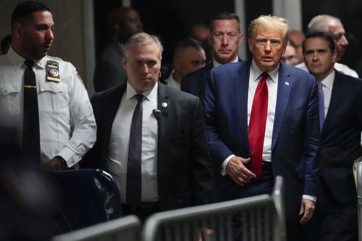 FILE - Former President Donald Trump leaves Manhattan criminal court, Feb. 15, 2024, in New York. Judge Juan Manuel Merchan agreed Friday, March 16, to delay former President Donald Trump?s hush-money criminal trial in New York until mid-April after his lawyers said they needed more time to sift through new evidence. (AP Photo/Mary Altaffer, File)