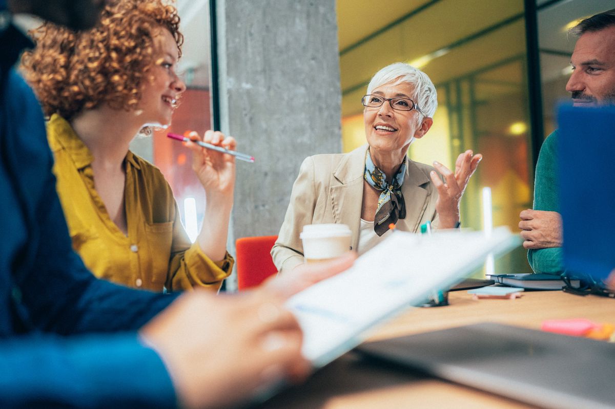Shot of a group of businesspeople sitting together in a meeting