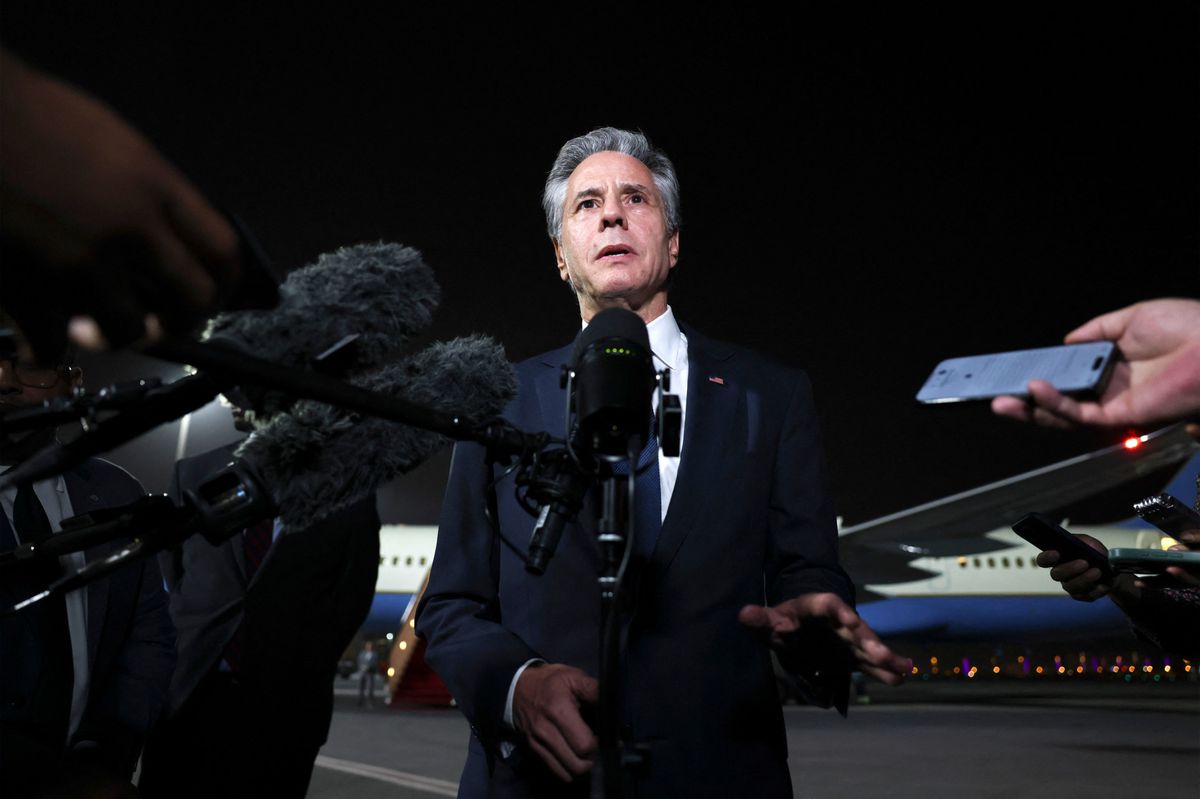 US Secretary of State Antony Blinken speaks to reporters on the tarmac in Doha on August 20, 2024. (Photo by Kevin MOHATT / POOL / AFP)
