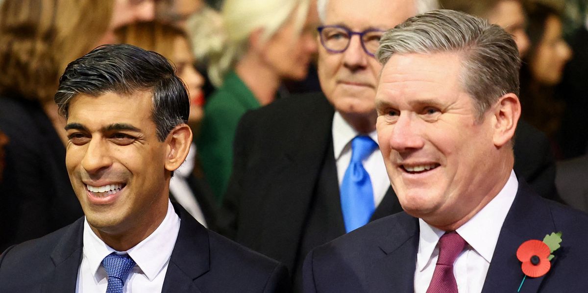 Britain's Prime Minister Rishi Sunak and Britain's main opposition Labour Party leader Keir Starmer arrive to the House of Commons Members' Lobby during the State Opening of Parliament at the Houses of Parliament in London on November 7, 2023. (Photo by HANNAH MCKAY / POOL / AFP)