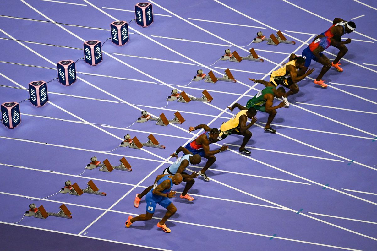 (Bottom to Top) Italy's Lamont Marcell Jacobs, Botswana's Letsile Tebogo, US' Noah Lyles, Jamaica's Oblique Seville, South Africa's Akani Simbine, Jamaica's Kishane Thompson, US' Fred Kerley, and US' Kenneth Bednarek compete at the start of the men's 100m final of the athletics event at the Paris 2024 Olympic Games at Stade de France in Saint-Denis, north of Paris, on August 4, 2024. (Photo by Mauro PIMENTEL / AFP)