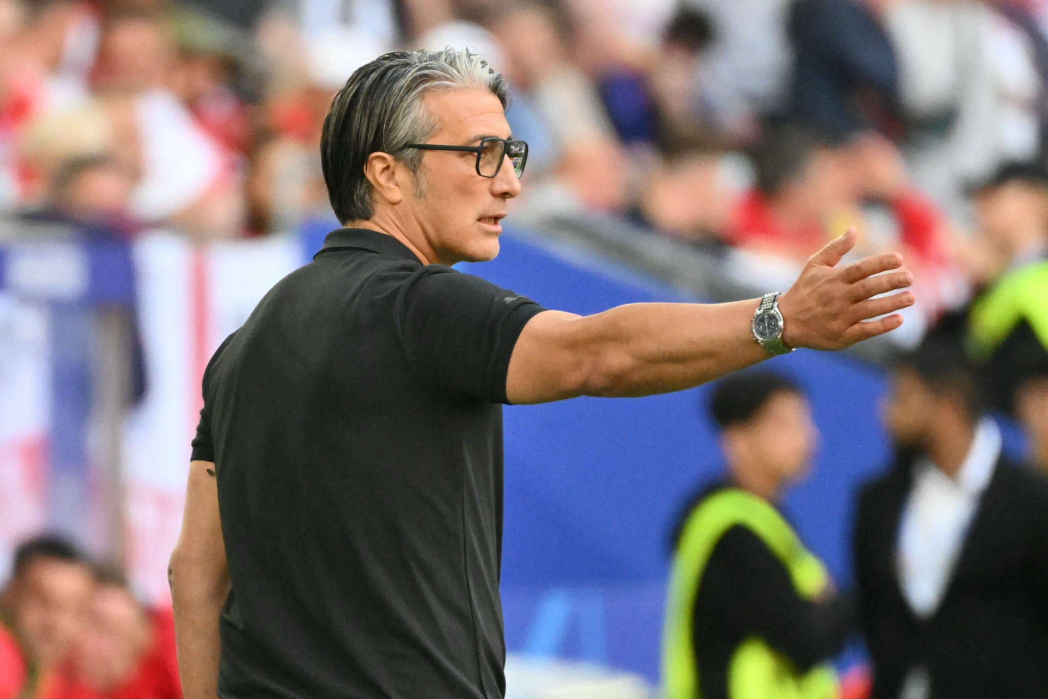 Switzerland's head coach Murat Yakin gestures during the UEFA Euro 2024 quarter-final football match between England and Switzerland at the Duesseldorf Arena in Duesseldorf on July 6, 2024. (Photo by Alberto PIZZOLI / AFP)