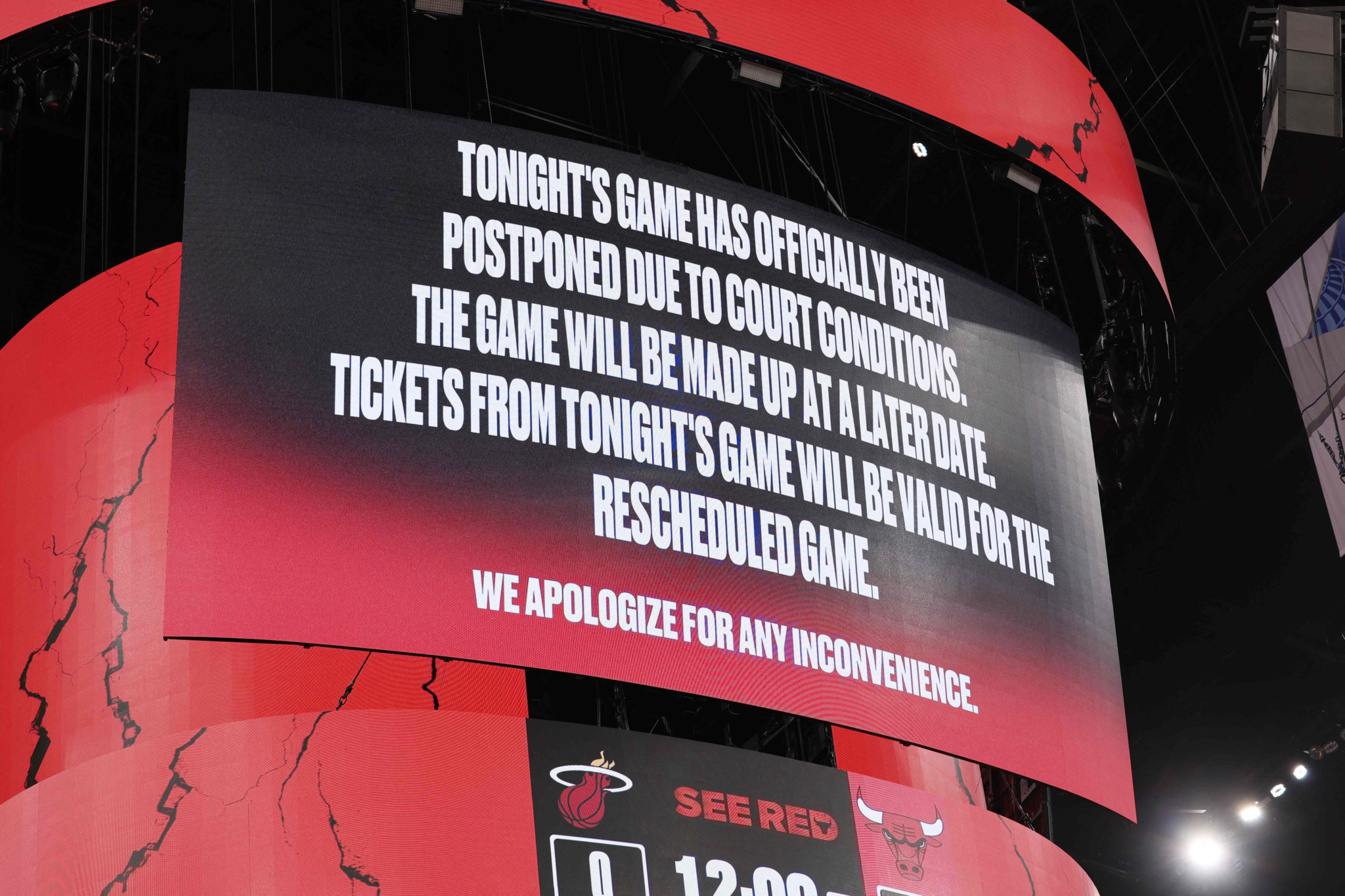 Jumbotron at the United Center in Chicago shows the Chicago Bulls' announcement that their game against the Miami Heat on January 8, 2026 has been postponed due to field conditions.