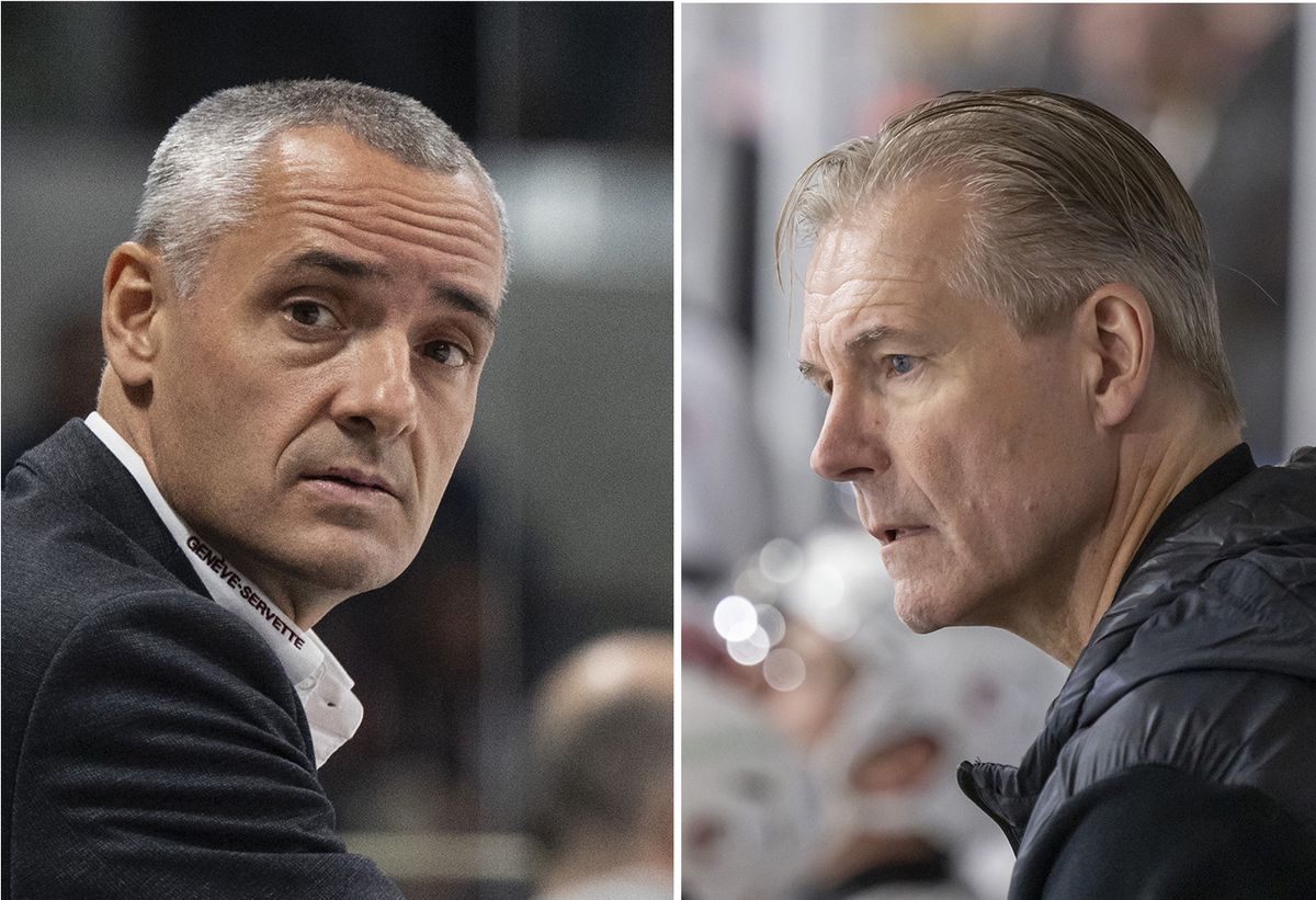 Deux hommes regardent attentivement quelque chose hors du cadre, l'un en costume formel et l'autre en veste décontractée, dans un environnement probablement sportif.
