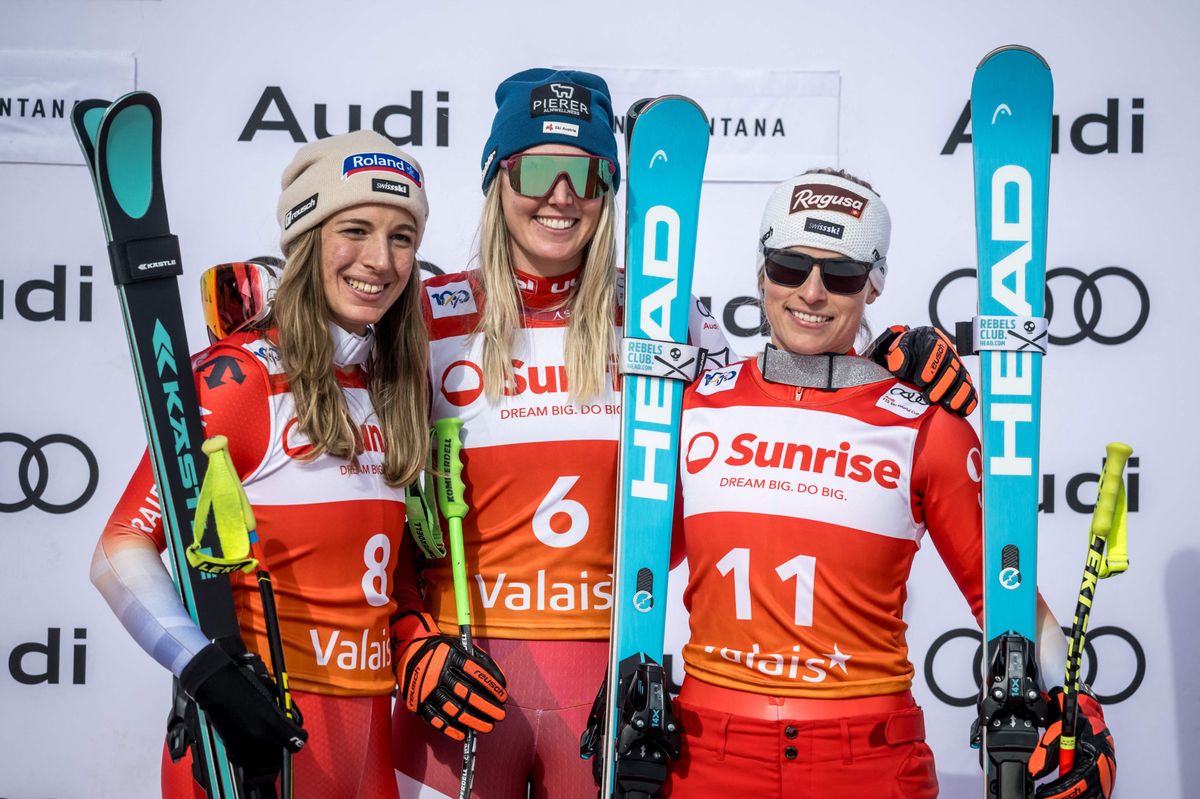 (From L) Second ex-aequo Switzerland's Jasmine Flury and Austria's Cornelia Huetter and winner Switzerland's Lara Gut-Behrami celebrate during the podium ceremony of Women's downhill event at the FIS Alpine Ski World Cup in Crans-Montana, on February 16, 2024. (Photo by Fabrice COFFRINI / AFP)