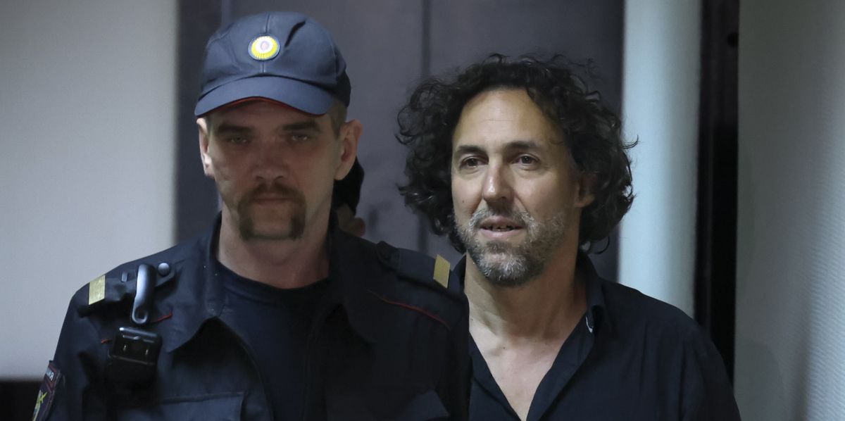 French citizen Laurent Vinatier, right, is escorted into a cage in a courtroom in the Zamoskvoretsky District Court in Moscow, Russia on Friday, June 7, 2024. A court in Moscow has ordered that the French citizen accused of collecting information on military issues in Russia be held in pre-trial custody. Vinatier was arrested in the Russian capital on Thursday as tensions have flared between Moscow and Paris following French President Emmanuel Macron?s statements about the possibility of deploying the country?s troops in Ukraine. (AP Photo)