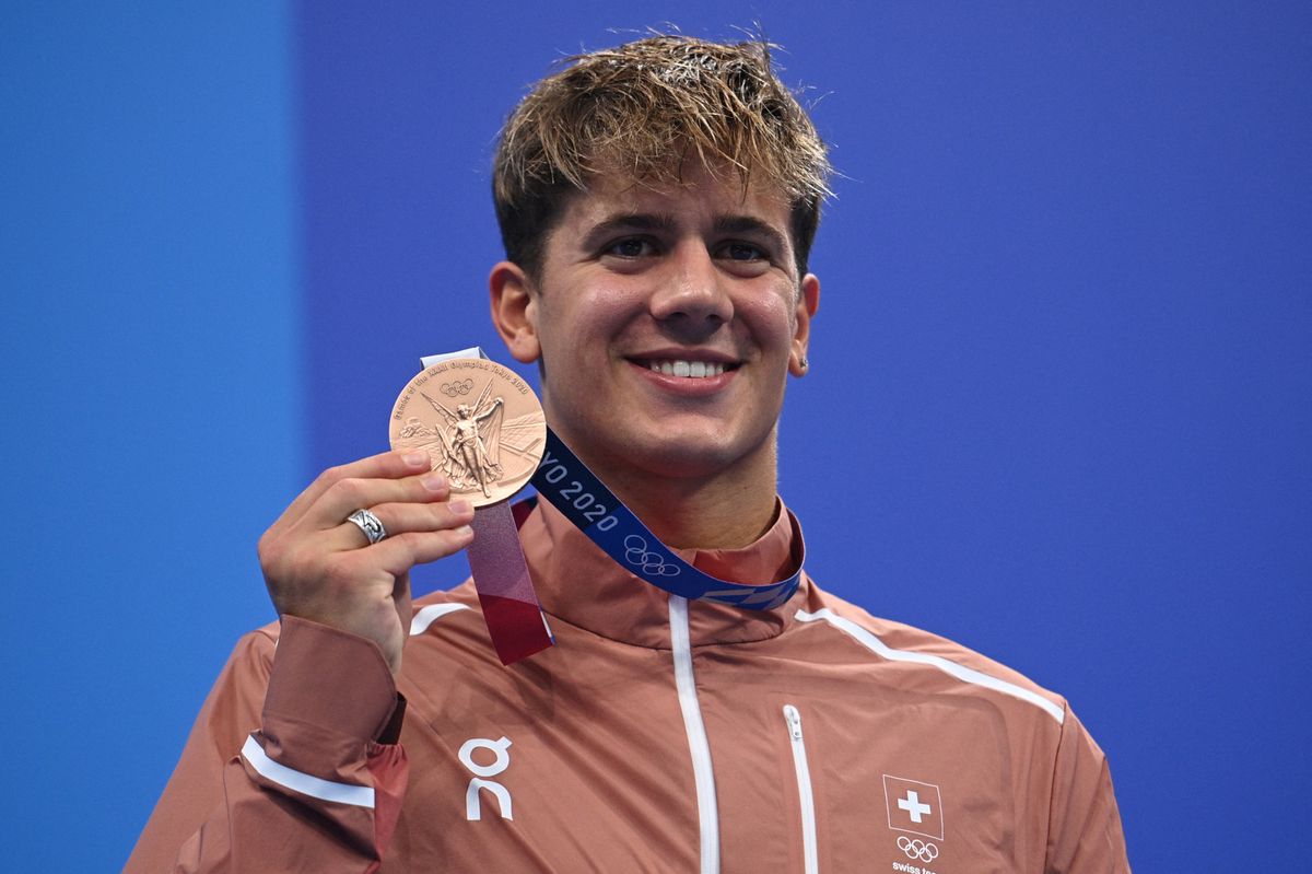 Bronze medallist Switzerland's Noe Ponti poses on the podium after the final of the men's 100m butterfly swimming event during the Tokyo 2020 Olympic Games at the Tokyo Aquatics Centre in Tokyo on July 31, 2021. (Photo by Oli SCARFF / AFP)