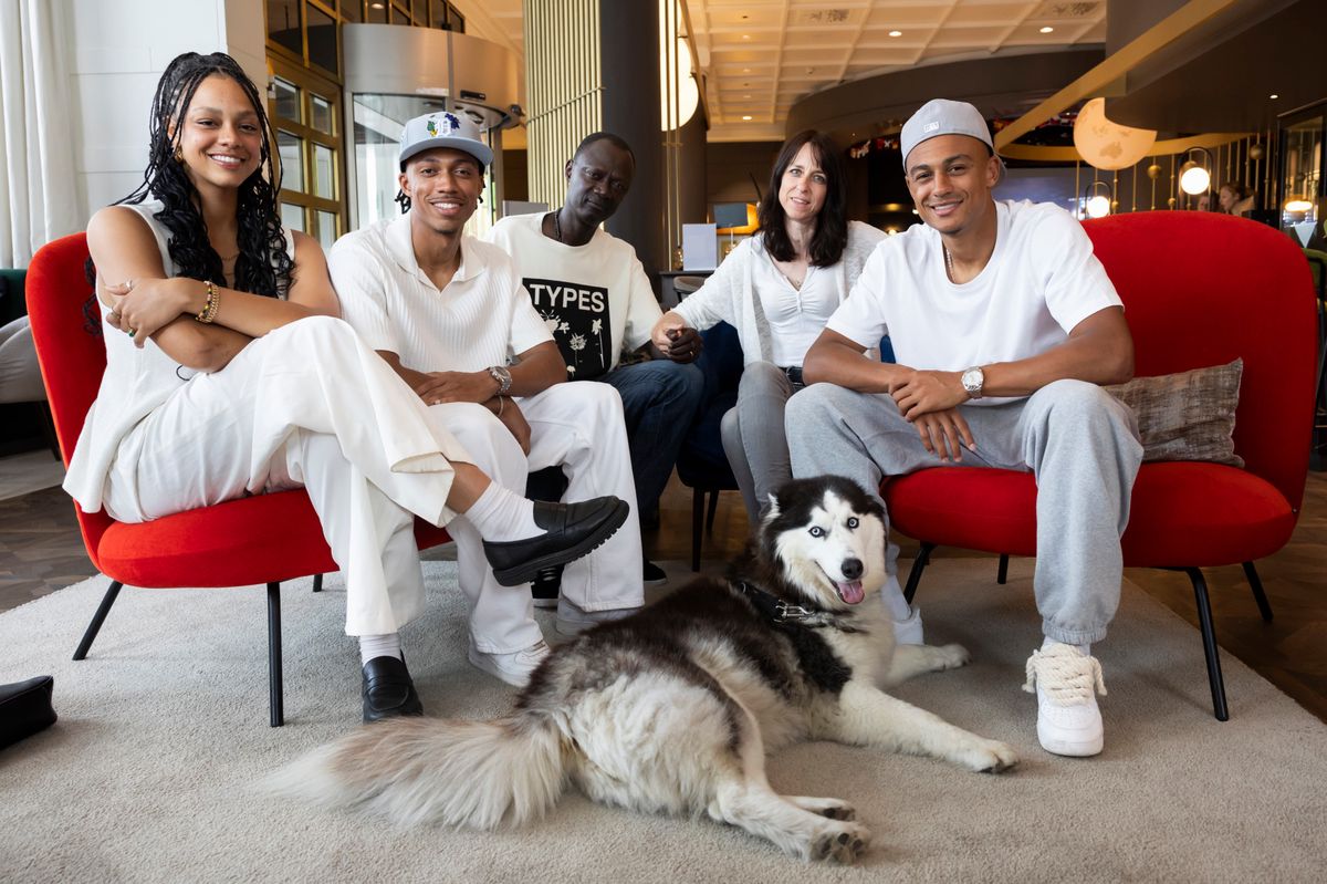 Dan Ndoye, right, poses with his mother, father, brother and sister in Stuttgart, Germany, Thursday, June 20, 2024. (KEYSTONE/Peter Klaunzer)