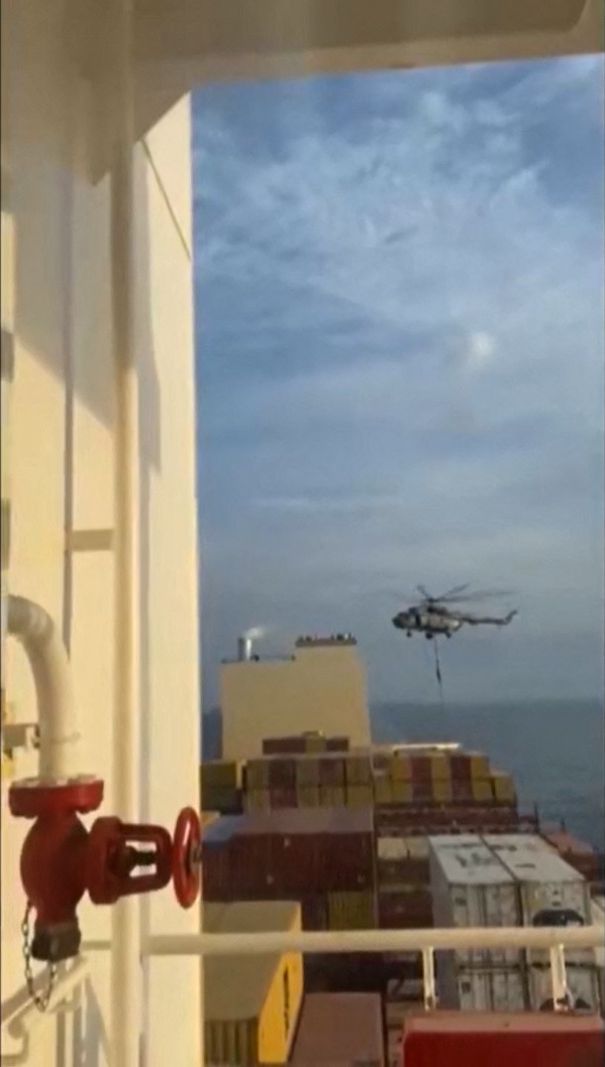 This image grab taken from a UGC video posted on social media on April 13, 2023, shows Iran's Revolutionary Guards rappelling down onto a container ship named, MSC Aries, near the Strait of Hormuz. Iran's Revolutionary Guards on Saturday seized a container ship "related to the Zionist regime (Israel) in the Gulf," state media reported, as tensions soar in the region. (Photo by AFP) / XGTY/RESTRICTED TO EDITORIAL USE - MANDATORY CREDIT AFP -  SOURCE: ANONYMOUS - NO MARKETING - NO ADVERTISING CAMPAIGNS -  DISTRIBUTED AS A SERVICE TO CLIENTS - NO ARCHIVE - AFP IS NOT RESPONSIBLE FOR ANY DIGITAL ALTERATIONS TO THE PICTURE'S EDITORIAL CONTENT / 
