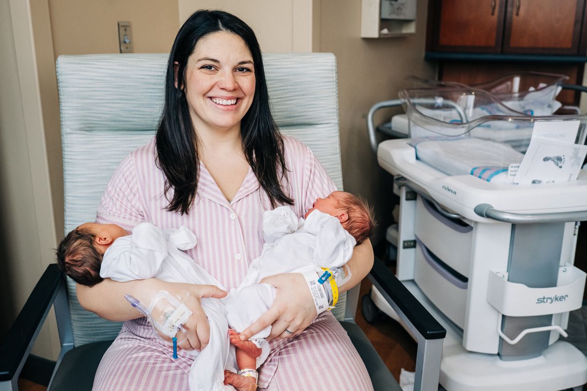 In this December 21, 2023, image courtesy of  the University of Alabama at Birmingham, Kelsey Hatcher holds her twin daughters Roxi Layla (L) and Rebel Laken (R). Hatcher, 32, from Alabama who was born with two uteruses and became pregnant in both gave birth to twin girls on different days, she announced on December 22, 2023. The first one, named Roxi Layla, was born on December 19 at 7:49 pm (0149 GMT December 20). She was joined by Rebel Laken on December 20 at 6:09 am. Each weighed over seven pounds (3.2 kilos). (Photo by ANDREA MABRY / University of Alabama Birmingham / AFP) / RESTRICTED TO EDITORIAL USE - MANDATORY CREDIT "AFP PHOTO / University of Alabama at Birmingham/Andrea MABRY" - NO MARKETING NO ADVERTISING CAMPAIGNS - DISTRIBUTED AS A SERVICE TO CLIENTS