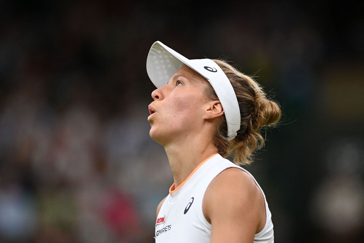 Switzerland's Viktorija Golubic returns against Czech Republic's Karolina Pliskova during their women's quarter-final tennis match on the eighth day of the 2021 Wimbledon Championships at The All England Tennis Club in Wimbledon, southwest London, on July 6, 2021. (Photo by Glyn KIRK / AFP) / RESTRICTED TO EDITORIAL USE