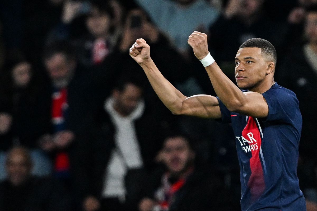 Paris Saint-Germain's French forward #07 Kylian Mbappe celebrates scoring his team's first goal during the UEFA Champions League round of 16 first leg football match between Paris Saint-Germain (PSG) and Real Sociedad at the Parc des Princes Stadium in Paris, on February 14, 2024. (Photo by MIGUEL MEDINA / AFP)