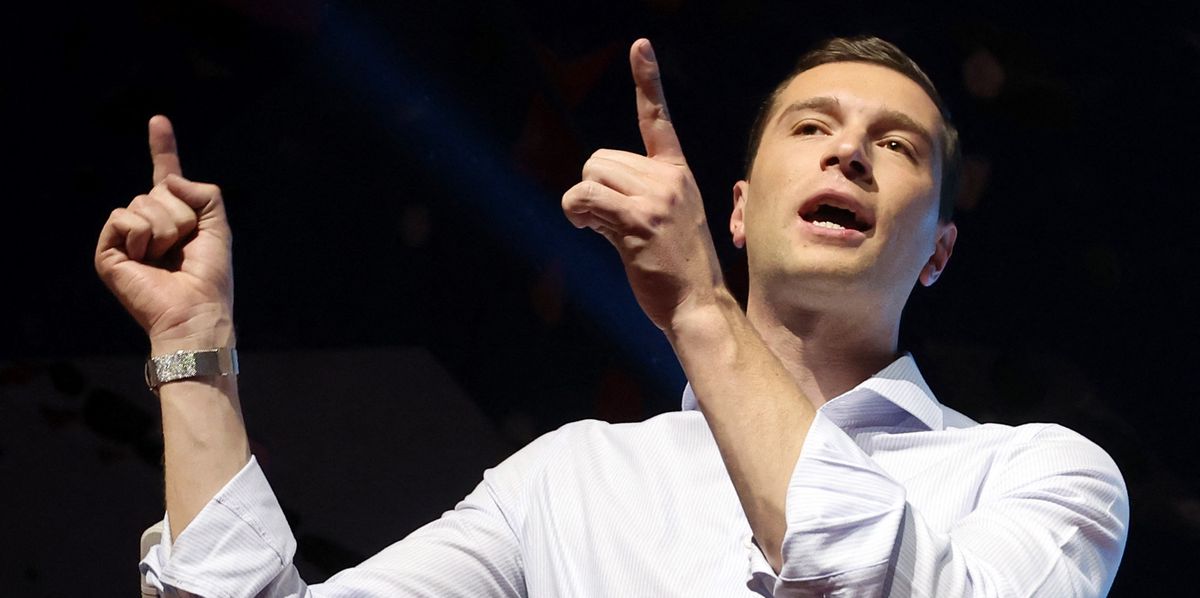 France's far-right Rassemblement National (RN) party’s President and lead European Parliament election candidate Jordan Bardella gestures on stage during a party campaign meeting ahead of the upcoming European Union (EU) parliamentary elections, in Henin-Beaumont, northern France, on May 24, 2024. (Photo by FRANCOIS LO PRESTI / AFP)