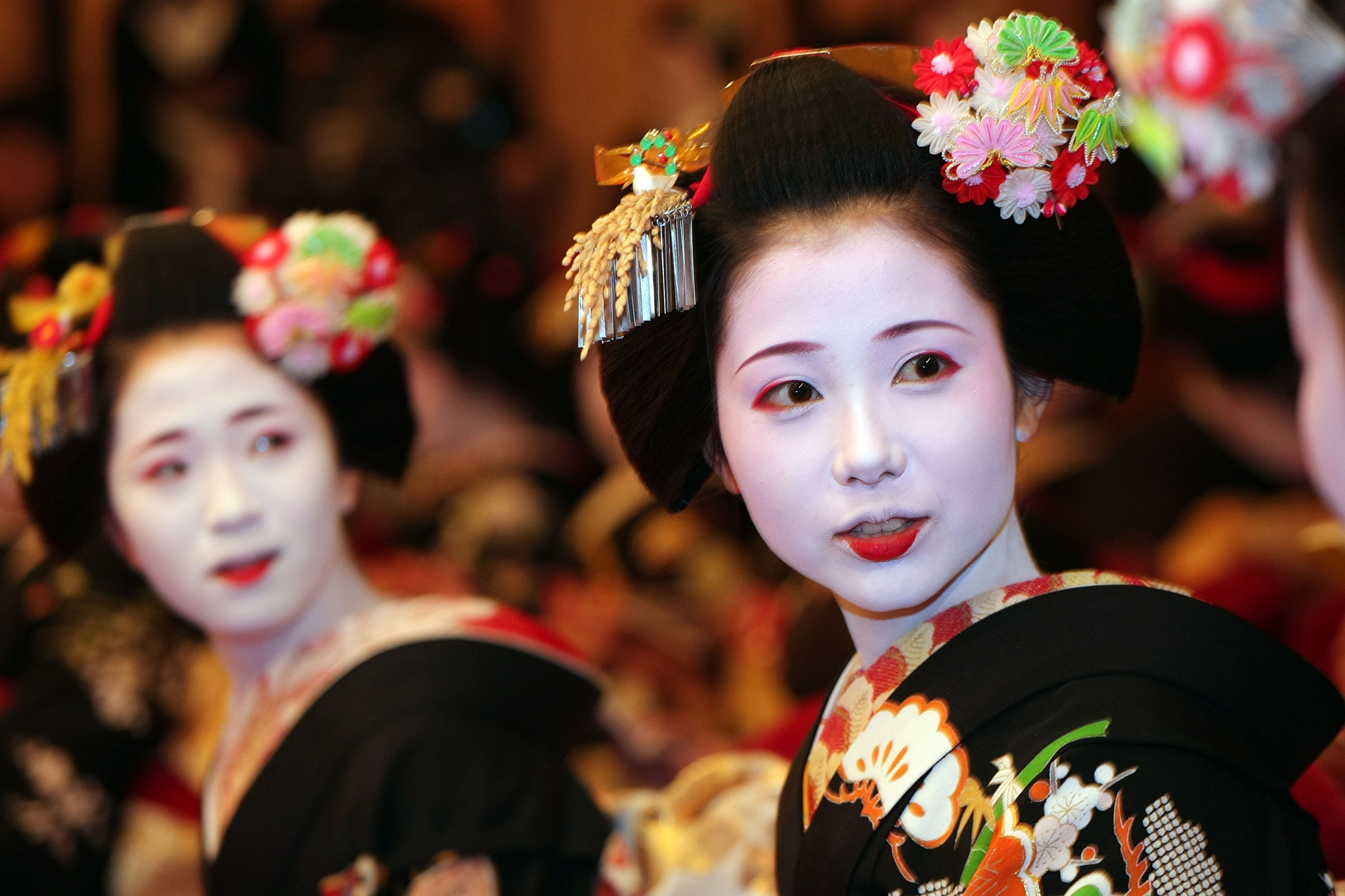 KYOTO, JAPAN - JANUARY 07: Traditional Japanese dancers Maiko and Geiko  attend a New Year's ceremony at the Gion Kobu Kaburenjo on January 7, 2008 in Kyoto, Japan. The traditional culture is still practiced especially in the area of Hanamachi in Kyoto, where it has begun to attract people's attention again.. (Photo by Koichi Kamoshida/Getty Images)