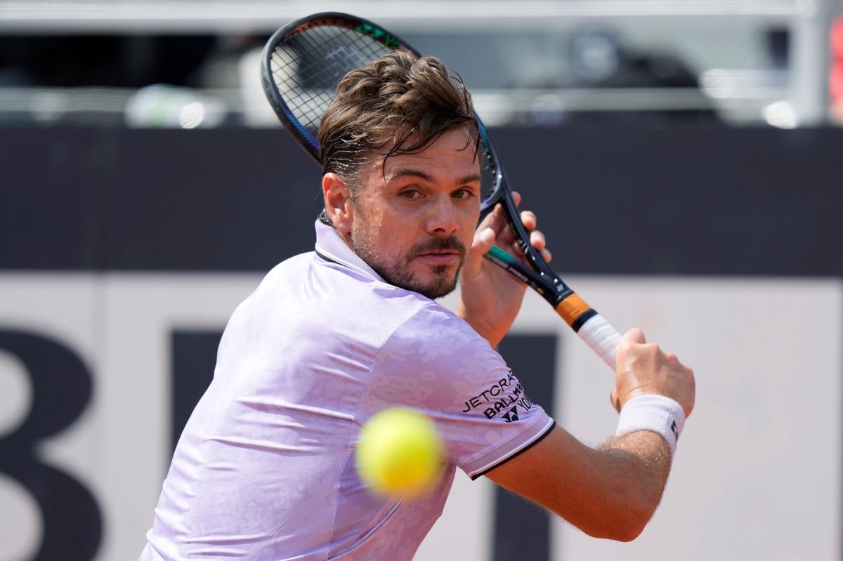 Switzerland's Stan Wawrinka returns the ball to Bulgaria's Grigor Dimitrov during their match at the Italian Open tennis tournament, in Rome, Friday, May 12, 2023. (AP Photo/Andrew Medichini)