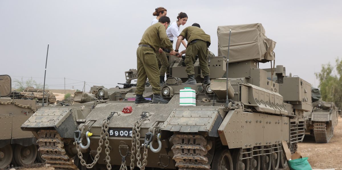 epa10909659 Israeli reservists stand on an armored personnel carrier (APC) at a military camp near Beer Sheva, Israel, 09 October 2023. Israeli chief military spokesperson Rear-Admiral Daniel Hagari said on 09 October that the country had drafted a record of 300,000 reservists. More than 700 Israelis were killed and over 2,000 were injured since the Islamist movement Hamas carried out an unprecedented attack on southern Israel on 07 October, the Israeli army said. According to Palestinian officials, more than 500 people were killed and nearly 3,000 were injured as a result of Israel’s retaliatory raids and air strikes in the Palestinian enclave. EPA/ABIR SULTAN