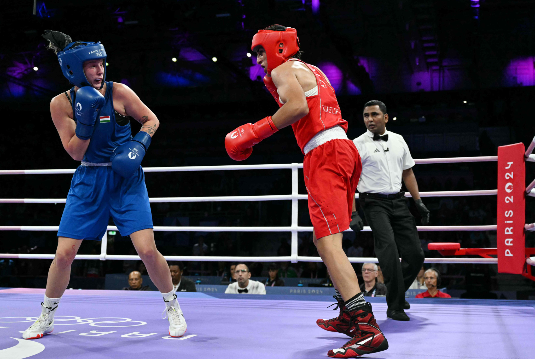 Algeria's Imane Khelif (R) fights against Hungary's Anna Luca Hamori in the women's 66kg quarter-final boxing match during the Paris 2024 Olympic Games at the North Paris Arena, in Villepinte on August 3, 2024. (Photo by MOHD RASFAN / AFP)