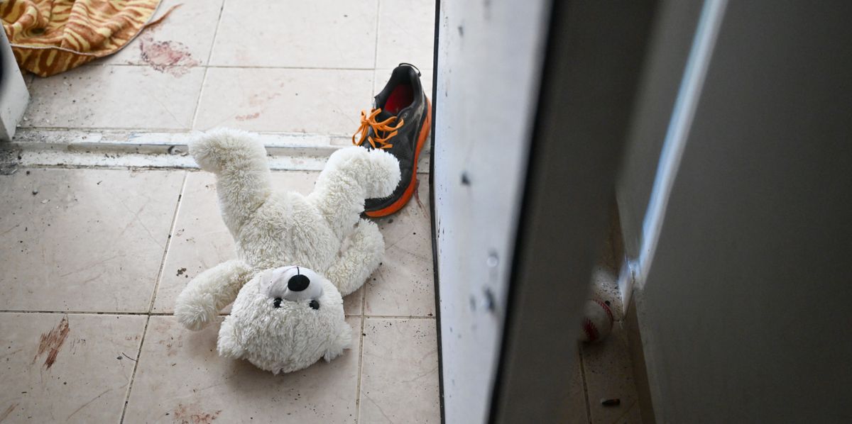 HOLIT, ISRAEL - NOVEMBER 01: A teddy bear is seen left on the ground near the bomb shelter of a kibbutz home attacked by Hamas on Oct 7th, near the border with Gaza, on November 01, 2023 in Holit, Israel. According to an IDF officer, two grandparents who resided here held the bomb shelter door closed during the attack to protect their grandchildren. All were injured but survived. (Photo by Alexi J. Rosenfeld/Getty Images)