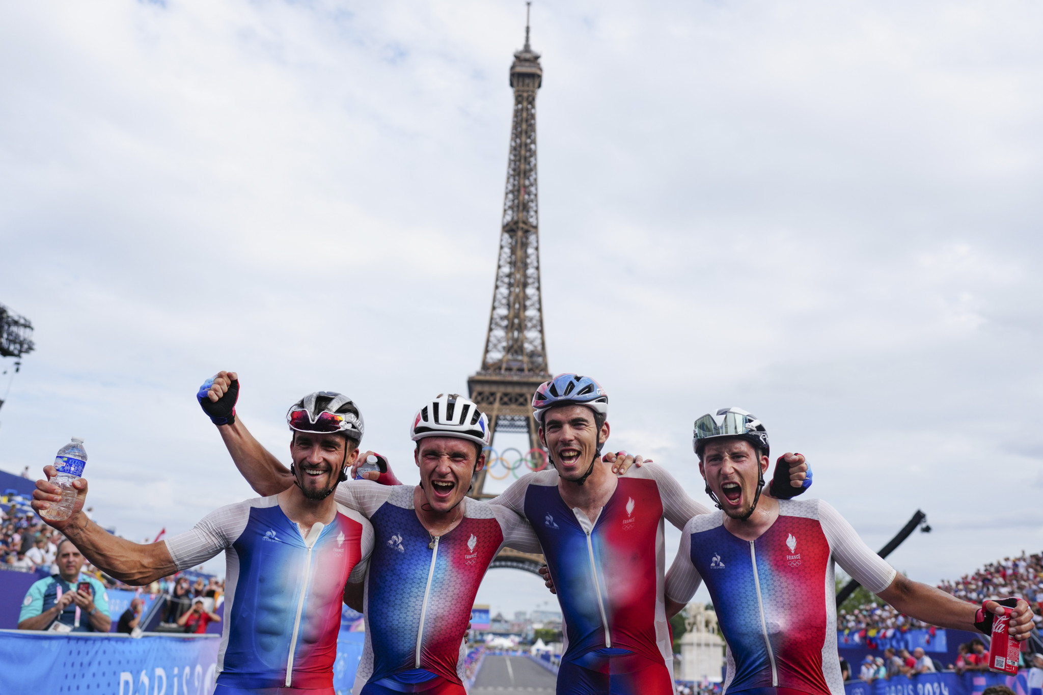 From left, France's Julian Alaphilippe, bronze medallist Christophe Laporte, silver medallist Valentin Madouas and Kevin Vauquelin, celebrate after completing the men's road cycling event, at the 2024 Summer Olympics, Saturday, Aug. 3, 2024, in Paris, France. (AP Photo/Thibault Camus)