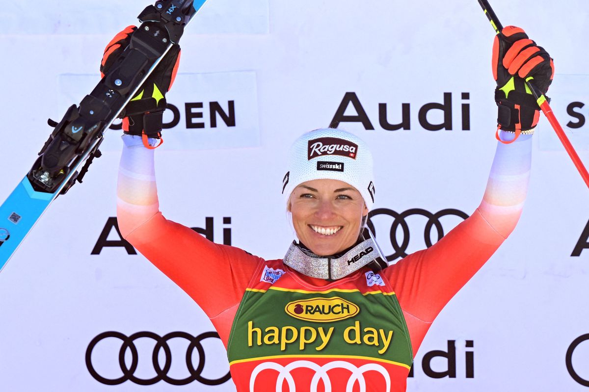 TOPSHOT - Winner Switzerland's Lara Gut-Behrami celebrates on the podium after the women's giant slalom event of the FIS Ski Alpine World Cup in Soelden, Austria on October 28, 2023. (Photo by KERSTIN JOENSSON / AFP)