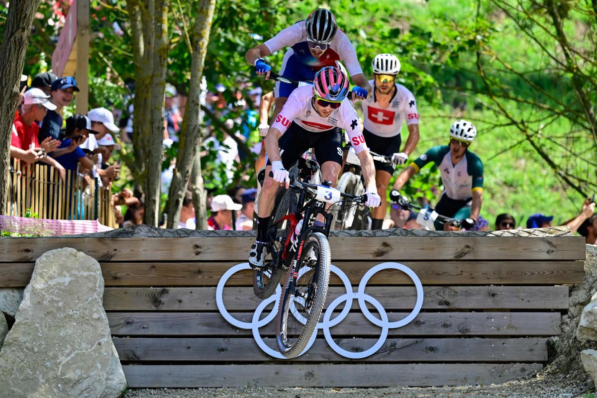 Switzerland's Mathias Flueckiger competes in the men's cross-country mountain biking event during the Paris 2024 Olympic Games in Elancourt Hill venue in Elancourt, on July 29, 2024. (Photo by John MACDOUGALL / AFP)
