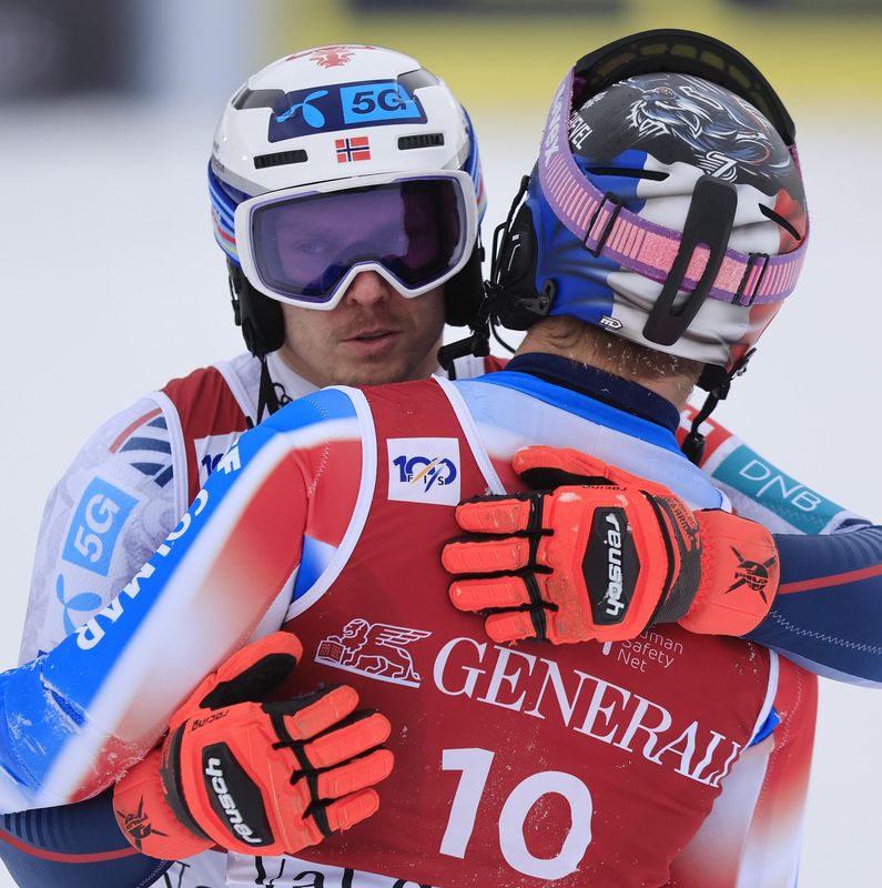 epa11778429 Henrik Kristoffersen (L) of Norway celebrates with Steven Amiez (R) of France after winning the Men's Slalom race of the FIS Alpine Skiing World Cup in Val d'Isere, France, 15 December 2024.  EPA/GUILLAUME HORCAJUELO