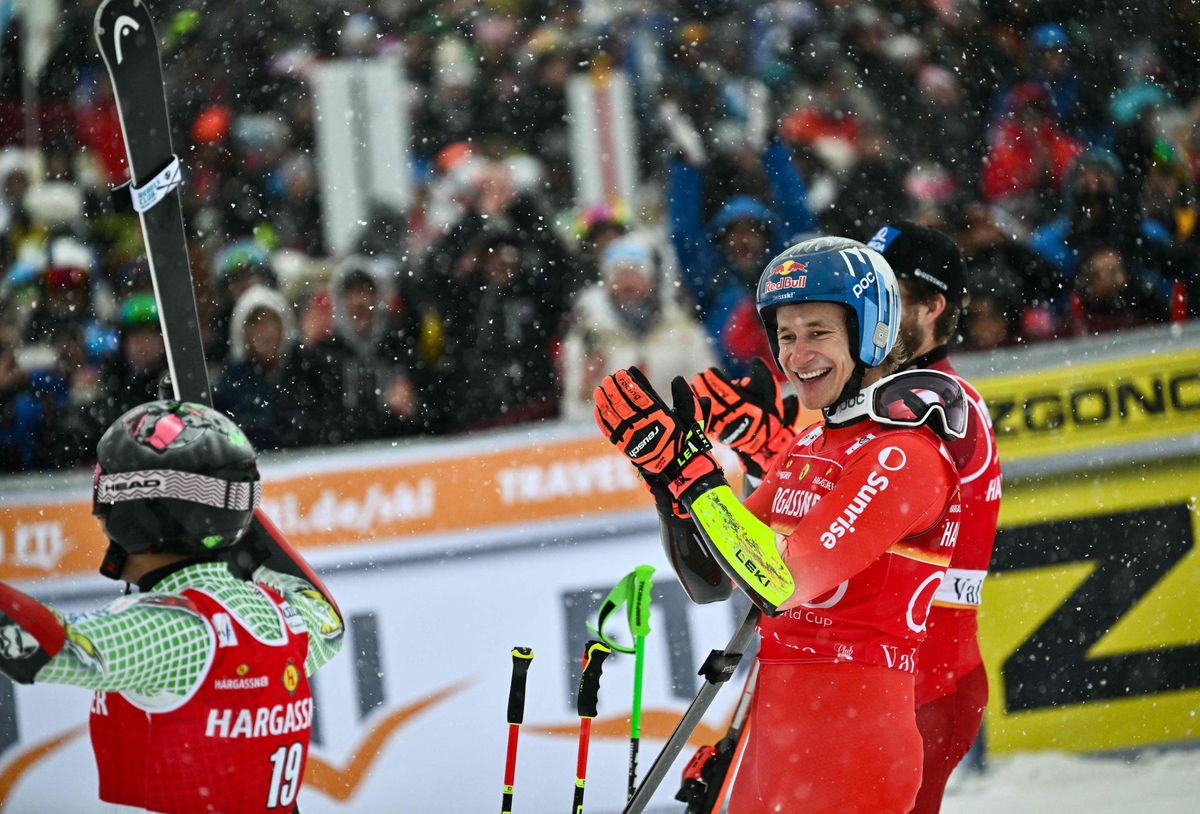 Second placed Austria's Marco Schwarz (R), first placed, Switzerland's Marco Odermatt (C) and third placed Andorra's Joan Verdu (L) celebrate on the podium after the Men's Giant Slalom event of the FIS Alpine Ski World Championship 2023 in Val d'Isere, French Savoy, on December 9, 2023. (Photo by Jeff PACHOUD / AFP)